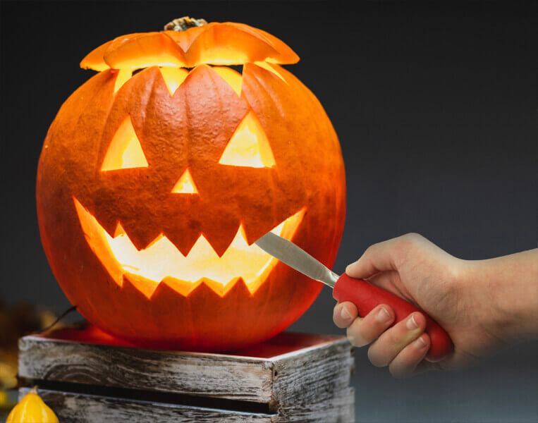 Halloween Pumpkin Being Carved with a Tenura Childrens Cutlery Grip
