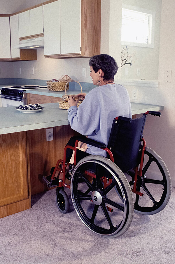 Woman in Wheelchair Accessible Kitchen