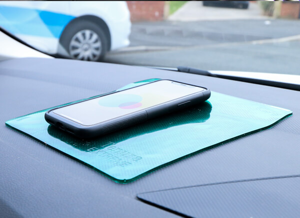Car Accessibility Tenura Extreme Mat Used as a Phone Holder in a Car