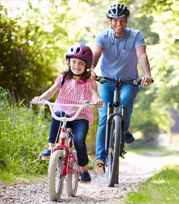 family-cycling-in-the-sun