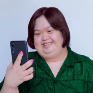 iadl-instrumental-activities-of-daily-living-communication-disabled-down-syndrome-woman-using-phone