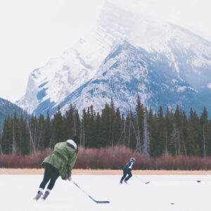 Couple Playing Ice Hockey