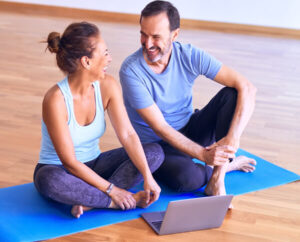 Couple Talking on Yoga Mat