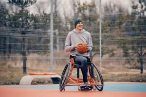 Wheelchair user playing basketball
