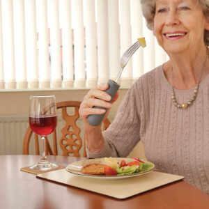 Women Using Cutlery Grips