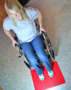 Women in Wheelchair with Tenura floor mat