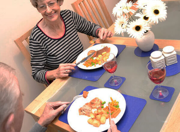 Senior Couple Dining with Tenura Non Slip Mats