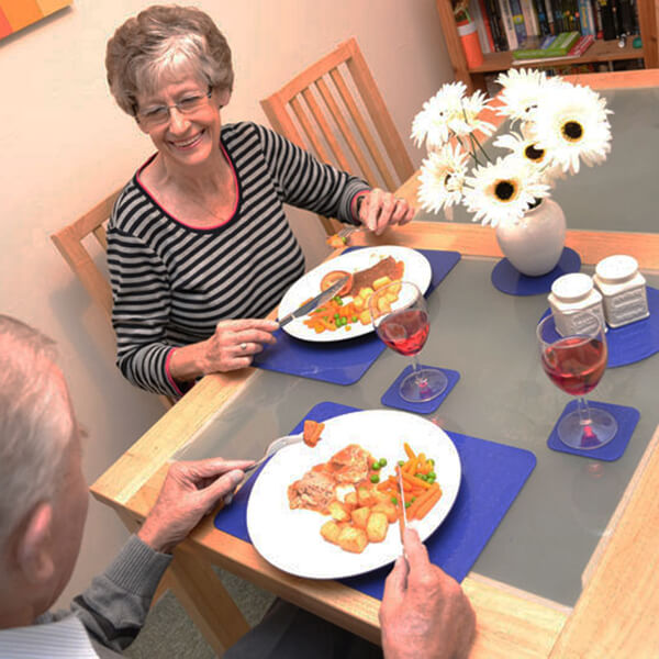 Senior Couple Dining with Tenura Non Slip Mats