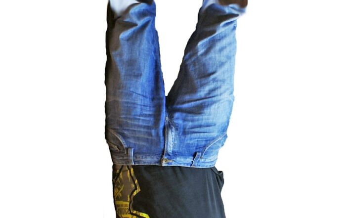 Man Standing on Tenura Extreme Mat Upside Down
