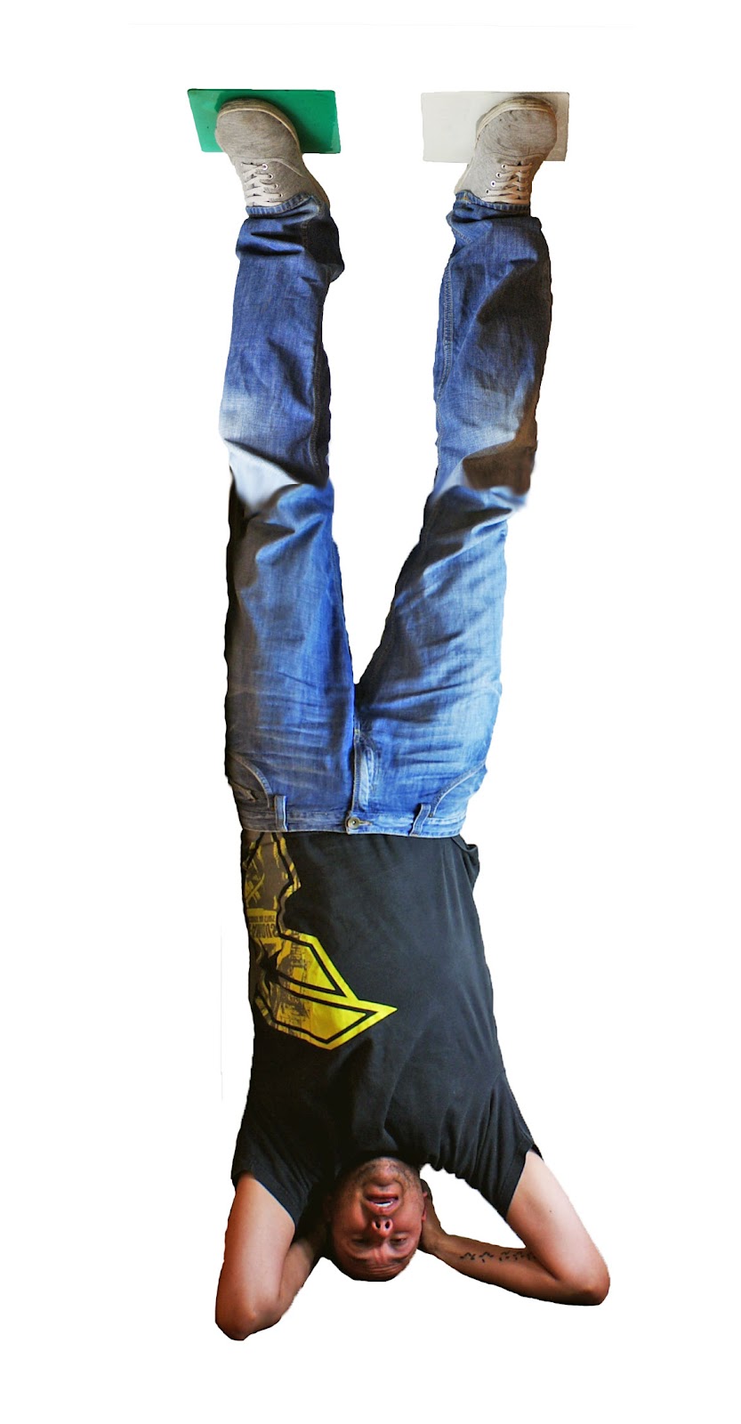 Man Standing on Tenura Extreme Mat Upside Down