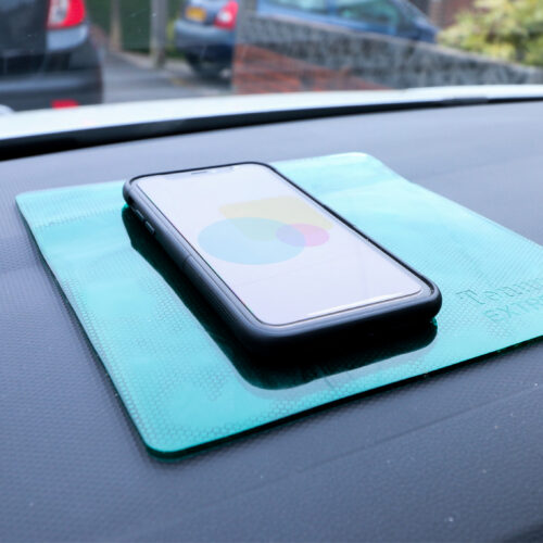 T-EG-2 Green Extreme Mat Used as a Phone Holder in a Car-3