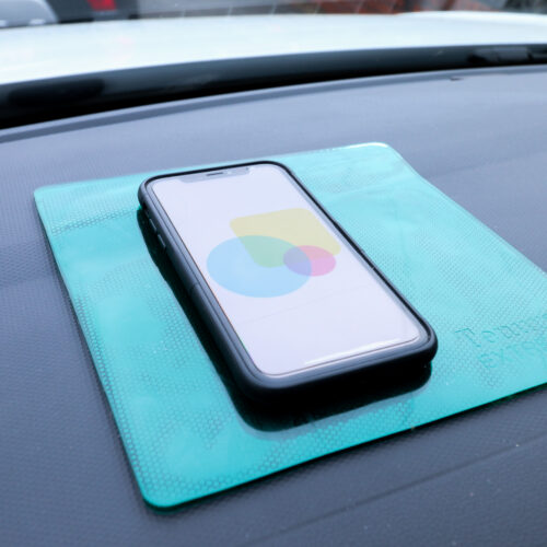 T-EG-2 Green Extreme Mat Used as a Phone Holder in a Car-2