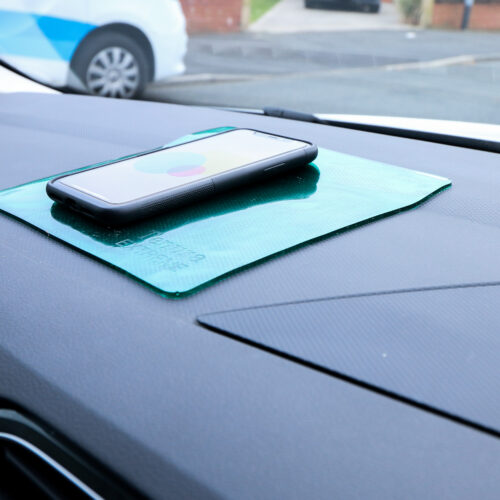 T-EG-2 Green Extreme Mat Used as a Phone Holder in a Car-4