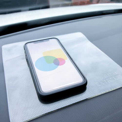 T-EG-1 Clear Extreme Mat Used as a Phone Holder in a Car-1